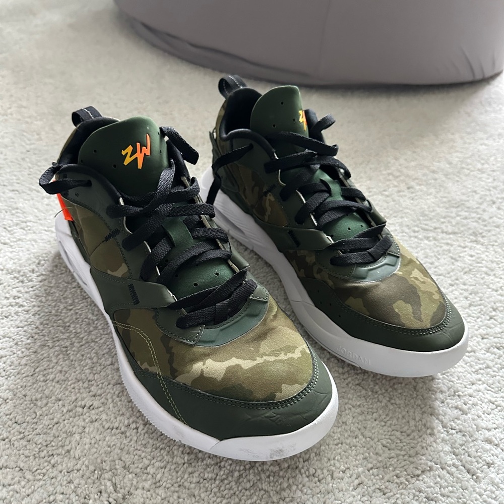 Jordan’s Camouflage Green Sneakers with Orange Logo